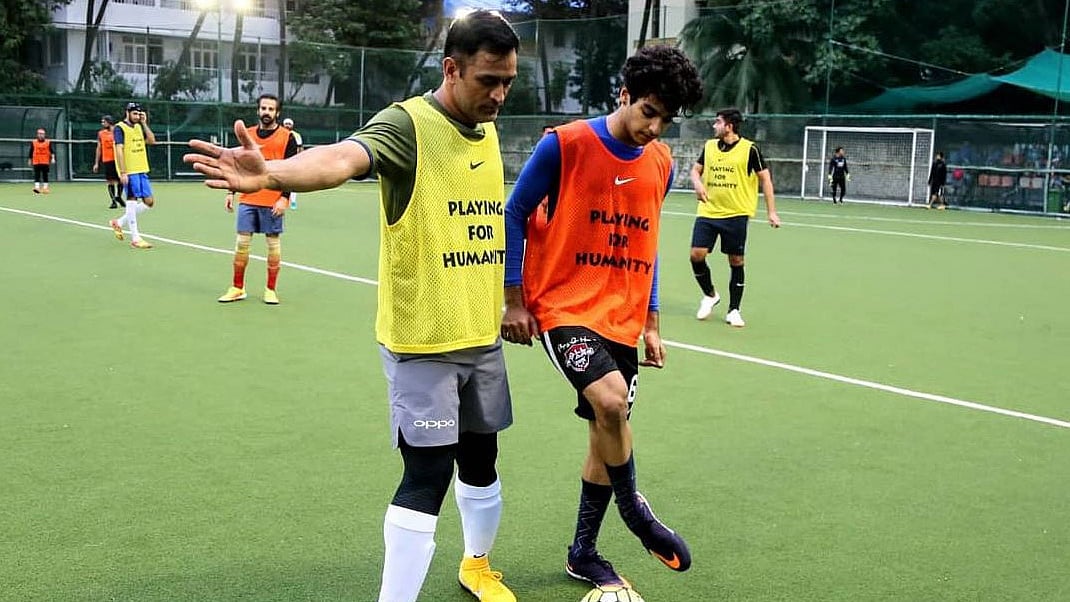 MS Dhoni plays football with Ishaan Khattar in Mumbai.