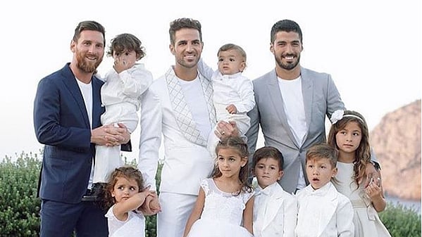 Lionel Messi, Cesc Fabregas and Luis Suarez with their children at Fabregas’ wedding celebrations in Ibiza on Tuesday.