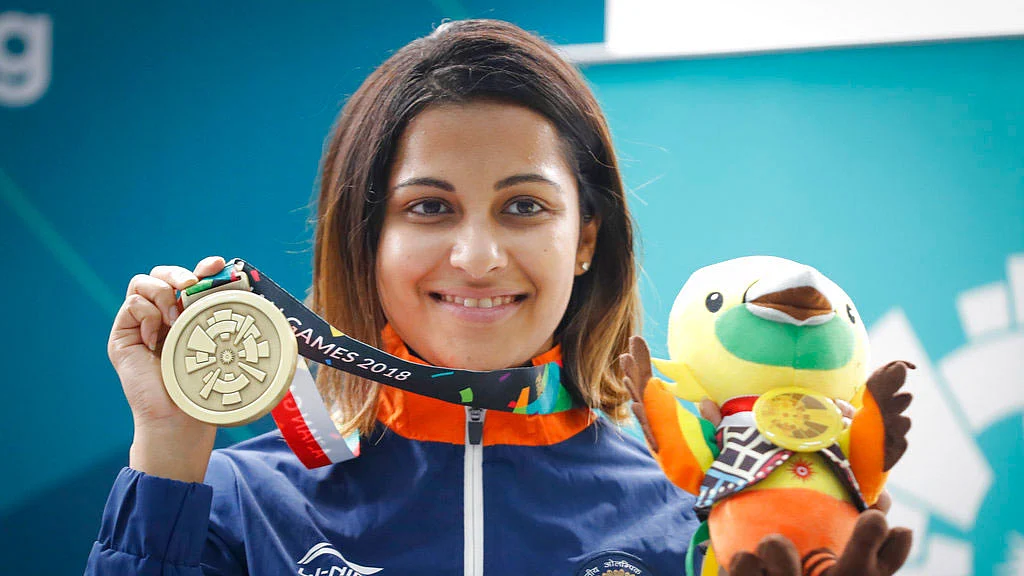 India’s Heena Sidhu poses with her bronze medal at the Asian Games.