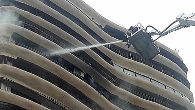 Firefighters douse fire that broke out in the 12th floor of 17-storey Crystal Tower building located in Parel, Mumbai.