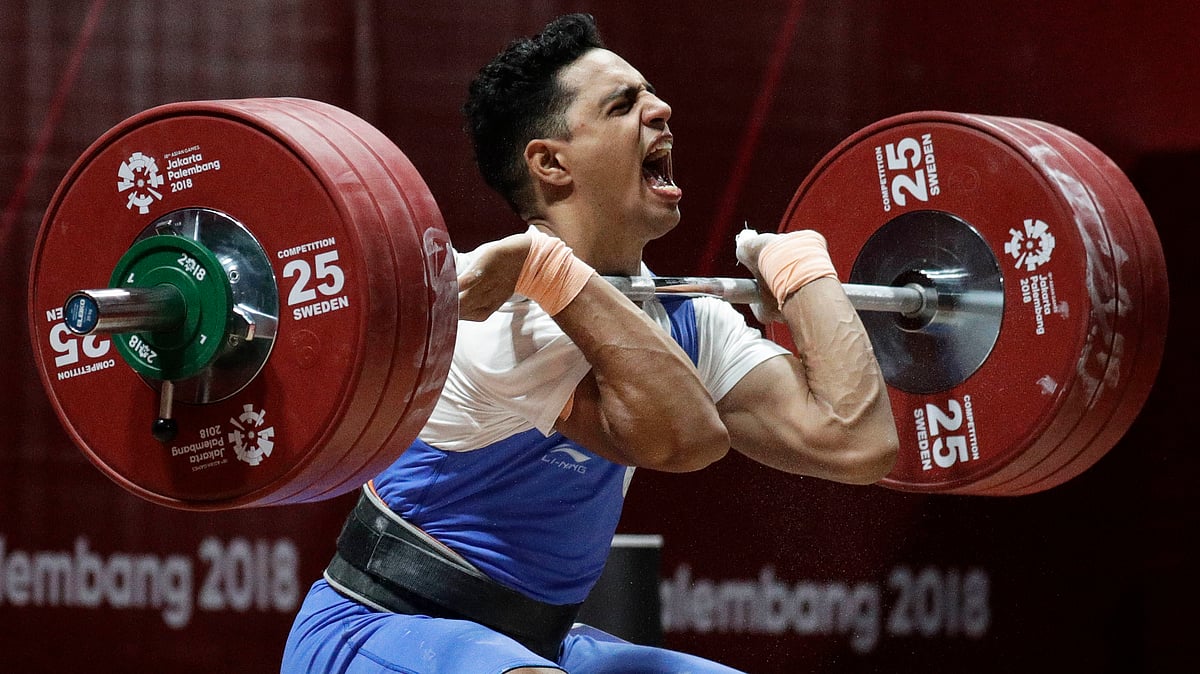 India’s Ajay Singh reacts during the men’s 77kg weightlifting at the 18th Asian Games in Jakarta, Indonesia, Thursday, Aug. 23, 2018.&nbsp;