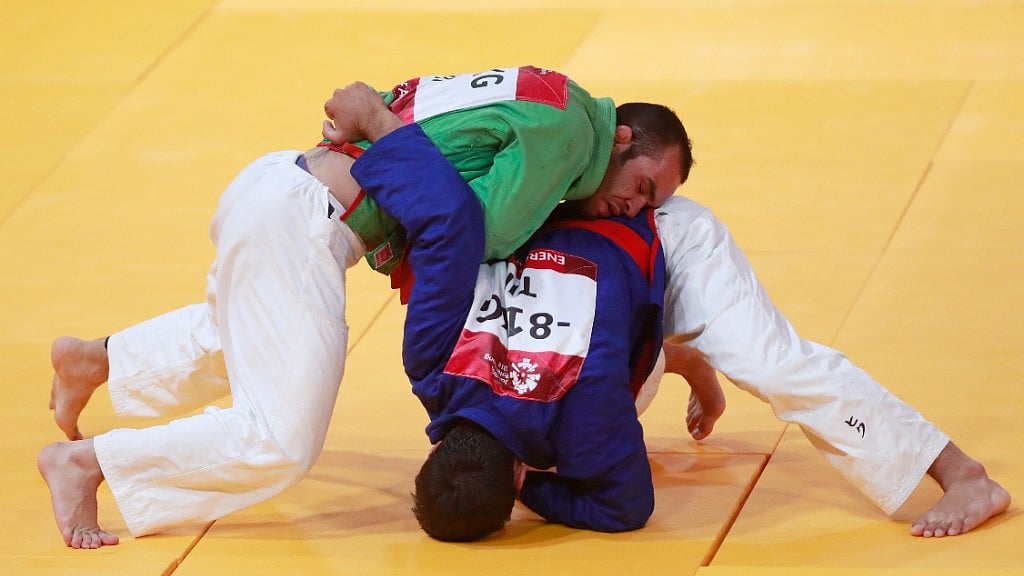 Iran’s Elyas Aliakbari, in green, competes against Tajikistan’s Behruzi Khojazoda during their men’s -81kg final kurash match. Image used for representational purpose.
