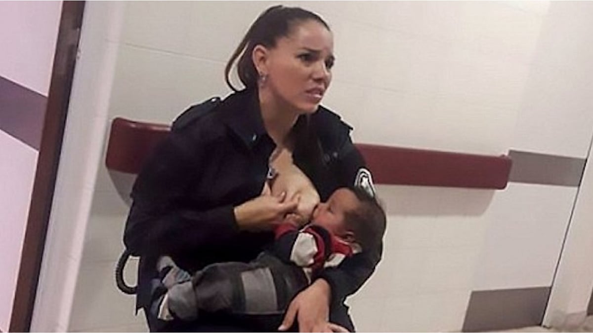 Officer Celeste Ayala breastfeeding the hungry baby.
