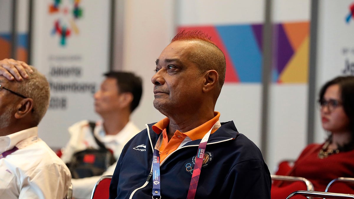In this Aug. 21, 2018, photo, India’s bridge player Finton Lewis, center, watches a bridge match competition game on a screen at the 18th Asian Games in Jakarta, Indonesia.&nbsp;