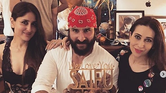 Saif Ali Khan poses with wife Kareena and sister-in-law Karisma Kapoor on his birthday.<i></i>