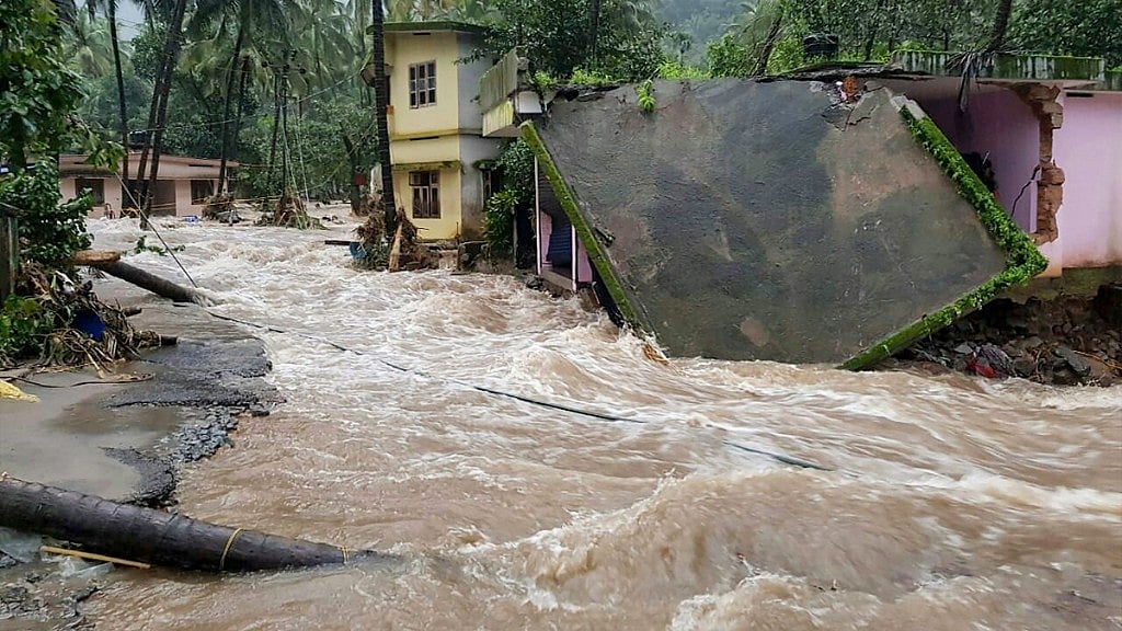 Roof of a house collapses following a flash flood, triggered by heavy rains, at Kodencheri in Kozhikode district of Kerala on Thursday, 9 August 2018.