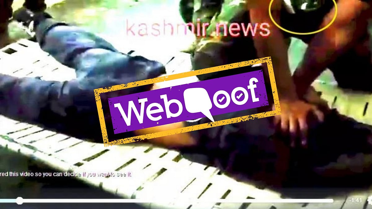 The man is being beaten up by a Pakistani soldier and not an Indian.