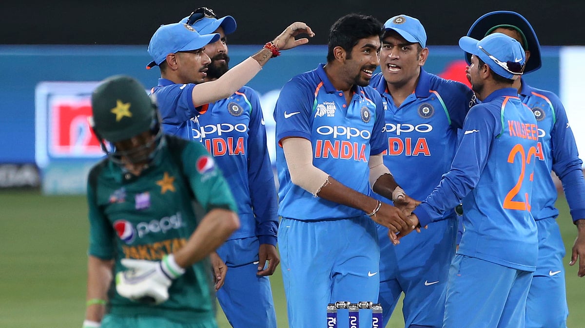 India’s Jasprit Bumrah, center without cap, celebrates with teammates the dismissal of Pakistan’s Shoaib Malik, left, during the one day international cricket match of Asia Cup between India and Pakistan in Dubai, United Arab Emirates, Sunday, Sept. 23, 2018.&nbsp;