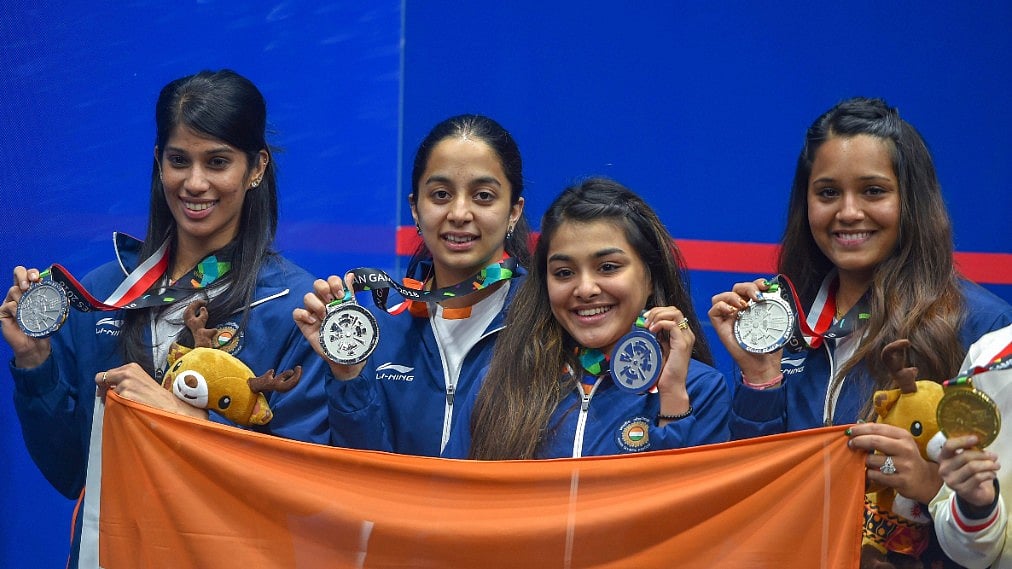 From left: Joshna Chinappa, Tanvi Khanna, Sunayna Kuruvilla and Dipika Pallikal pose with the medals at the medal ceremony of the 18th Asian Games.