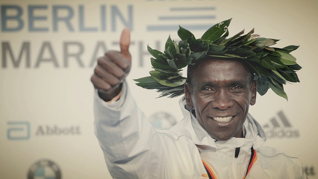 Gold medalist Eliud Kipchoge celebrates during the winning ceremony for the 45th Berlin Marathon in Berlin, Germany, Sunday, 16 September 2018. Eliud Kipchoge set a new world record in 2 hours 1 minute 39 seconds.&nbsp;