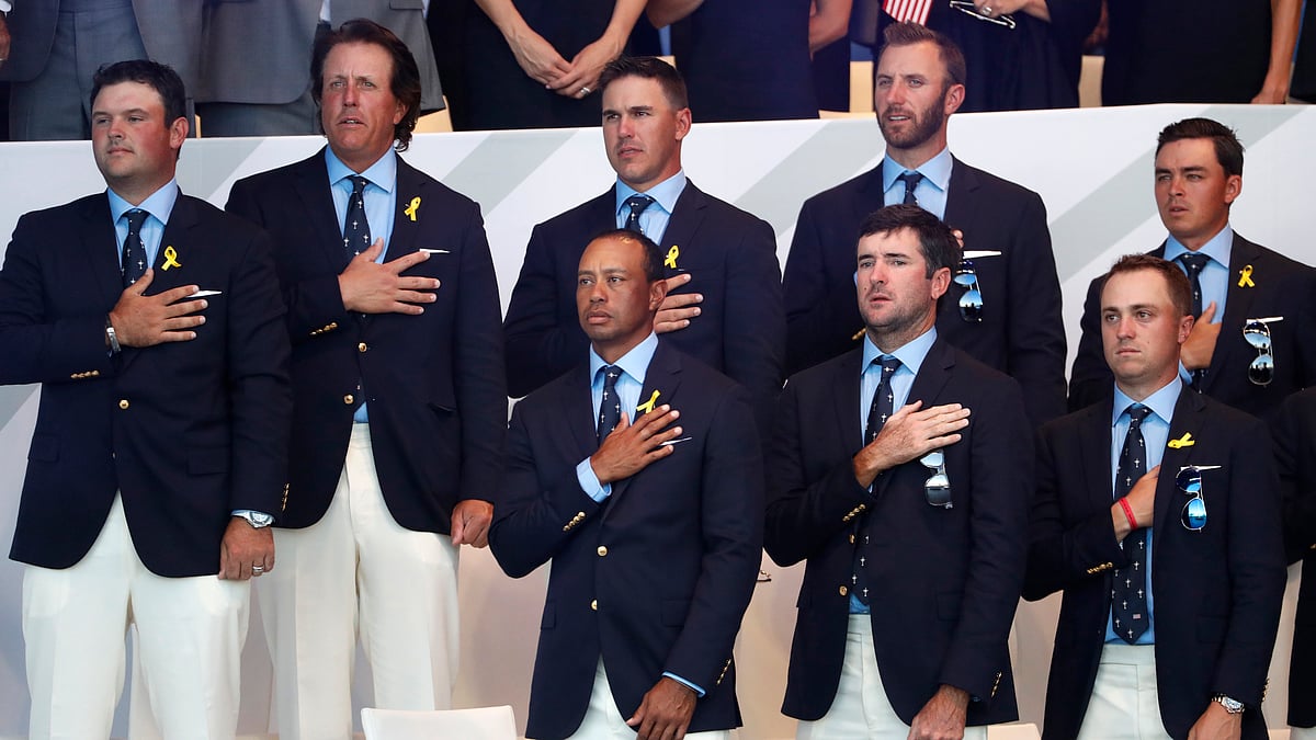 US team players observe the US national anthem during the opening ceremony of the Ryder Cup at Le Golf National in Saint-Quentin-en-Yvelines, outside Paris, France, Thursday, Sept. 27, 2018. The 42nd Ryder Cup will be held in France from Sept. 28-30, 2018 at Le Golf National.