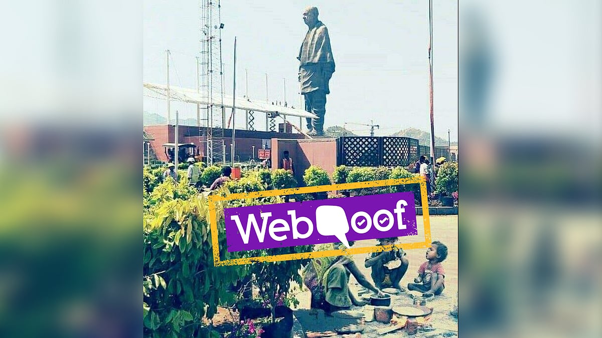 The photo of a woman and two children eating has been superimposed onto a photo of the Statue of Unity.