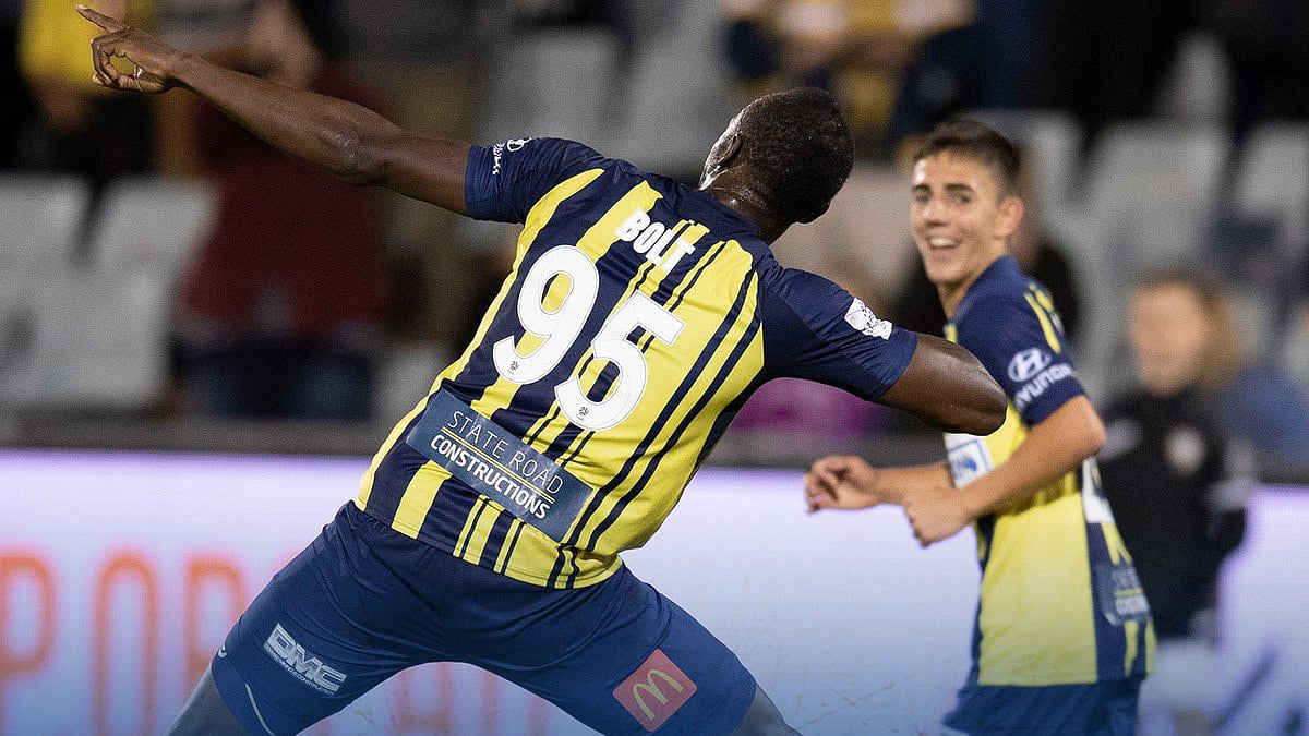 Usain Bolt celebrating his first goal with his trademark Lightning Bolt celebration.