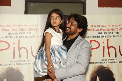New Delhi: Child actor Myra Vishwakarma along with director Vinod Kapri during the special screening of the upcoming film "Pihu" in New Delhi on Nov 9, 2018. (Photo: Amlan Paliwal/IANS)
