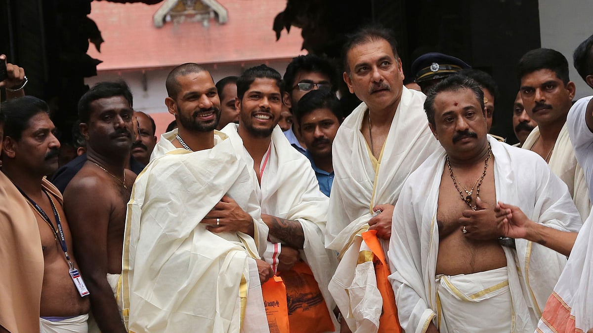 Shikhar Dhawan, Umesh Yadav and Ravi Shastri.