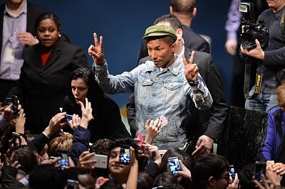 Singer Pharrell Williams (C). (Xinhua/Niu Xiaolei/IANS)