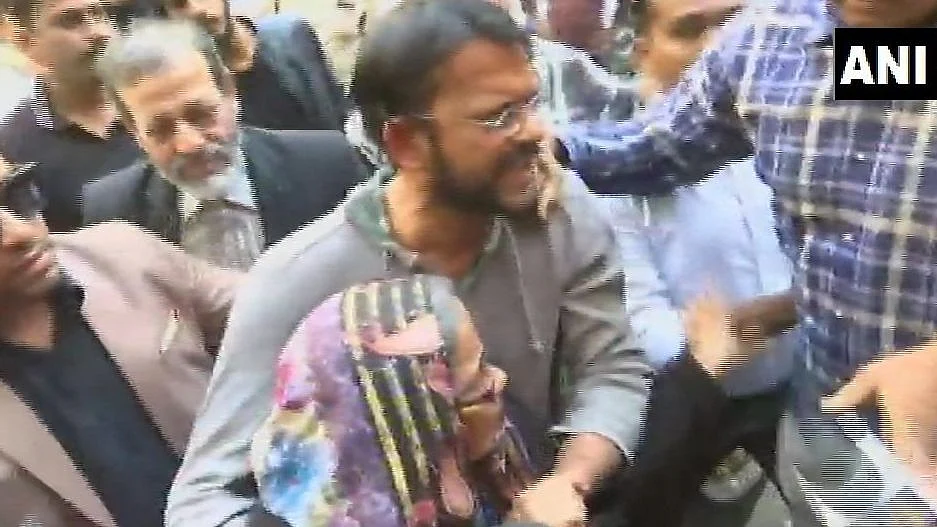 Hamid Ansari entering his residence with his mother.