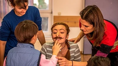 Actress Stana Katic at an orphanage in Bulgaria with members of the Absentia crew