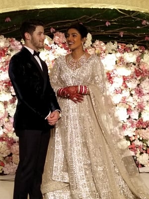New Delhi: Actress Priyanka Chopra and her husband American singer Nick Jonas at their wedding reception in New Delhi on Dec 4, 2018. (Photo: IANS)