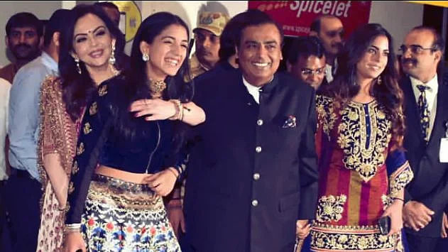 Mukesh Ambani, Isha Ambani, Nita Ambani, Radhika Merchant and Anant Ambani arrived at the airport, decked up to the nines - all smiles.
