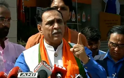 New Delhi: Gujarat Chief Minister and BJP leader Vijay Rupani addresses a press conference, in New Delhi on Sept 9, 2018. (Photo: IANS/BJP)