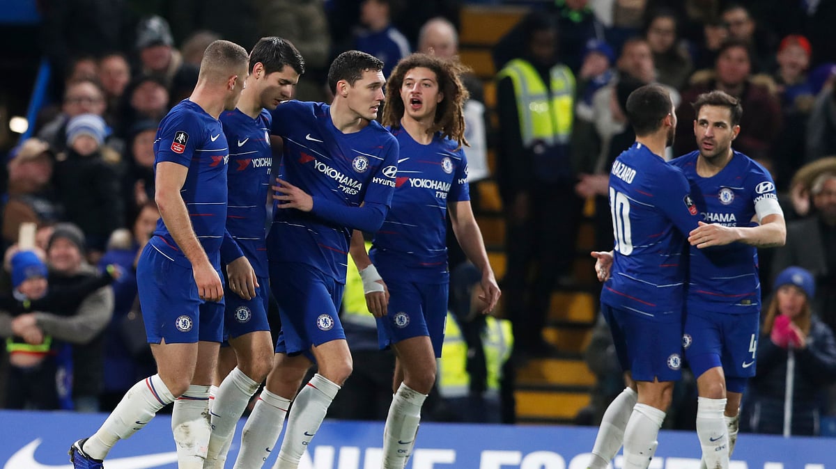 Titleholder Chelsea progressed to the last 32 after a 2-0 win over second-tier Nottingham Forest.