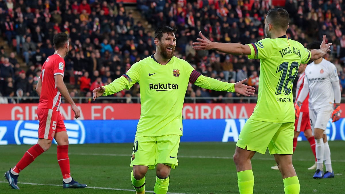 Lionel Messi coolly put the result beyond doubt in a 2-0 victory for Barcelona at 10-man Girona on Sunday.