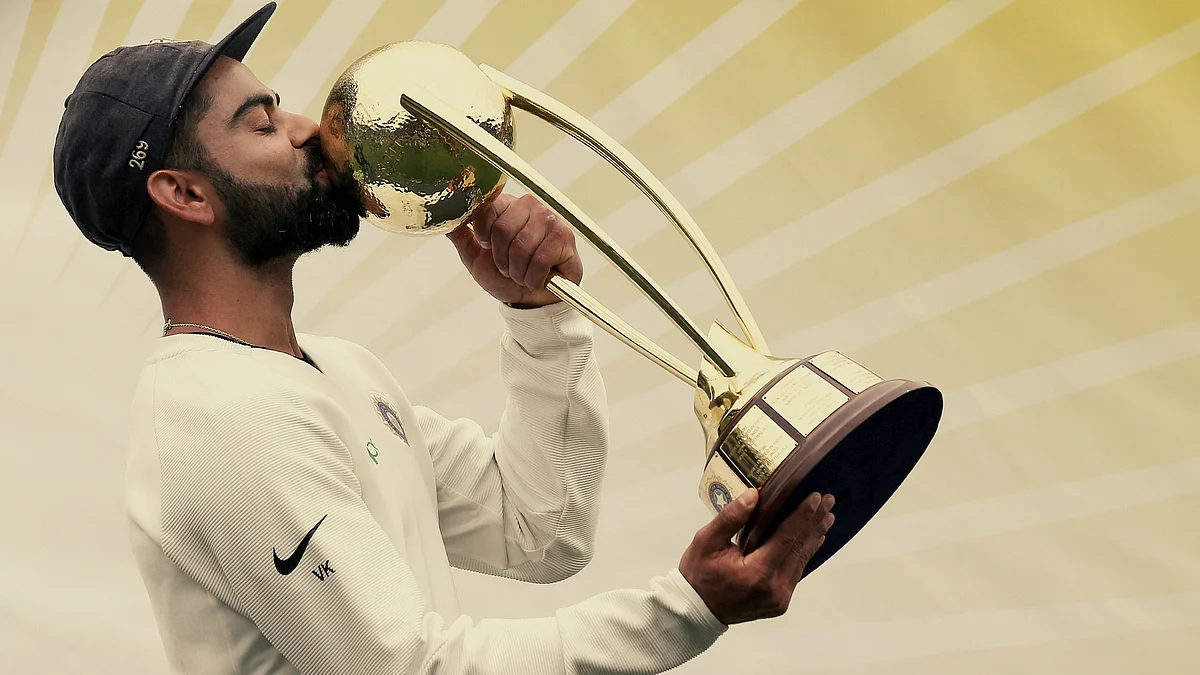 Virat Kohli lifts the Border-Gavaskar Trophy after India won their maiden Test series in Australia.