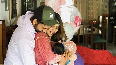 The 31-year-old batsman took to Instagram to share a photo with his wife and baby.