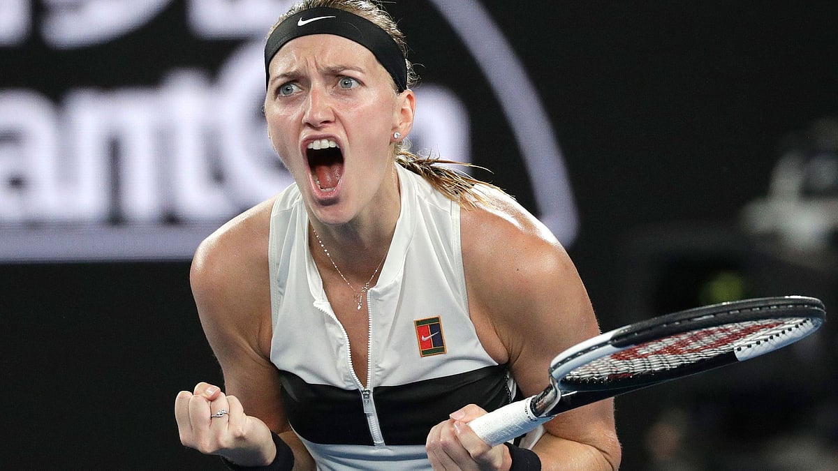 Petra Kvitova celebrates after winning the opening set of her Australian Open semi-final against Danielle Collins.