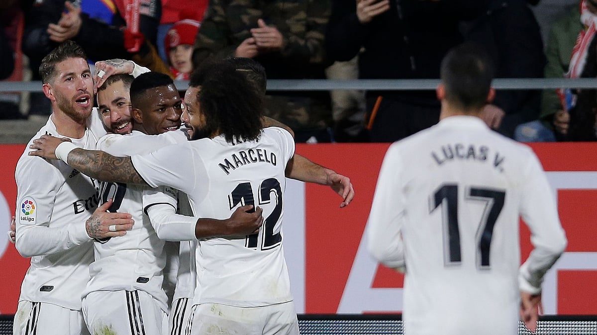 Real Madrid’s Benzema (second left) celebrates with teammates after scoring during their Spanish Copa del Rey match against Girona at the Montilivi stadium in Girona, Spain on Thursday.