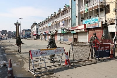 Srinagar: Security personnel man a Srinagar street during a separatist-called shutdown in the Kashmir Valley to mark the 35th death anniversary of Jammu and Kashmir Liberation Front (JKLF) founder, Maqbool Bhat on Feb 11, 2019. (Photo: IANS)