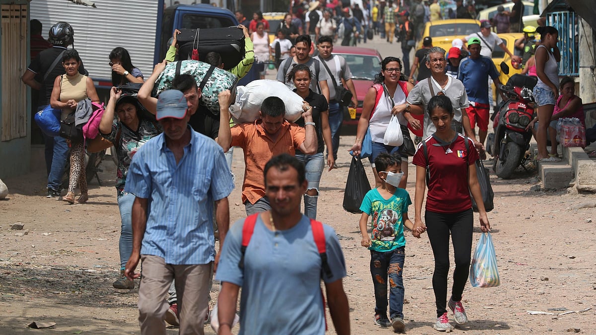 Venezuelans cross illegally into Colombia, at a blindspot on the border near the Simon Bolivar International Bridge in La Parada, Colombia on Thursday, 28 February, 2019. The border between Colombia and Venezuela has been closed indefinitely by the Venezuelan government.
