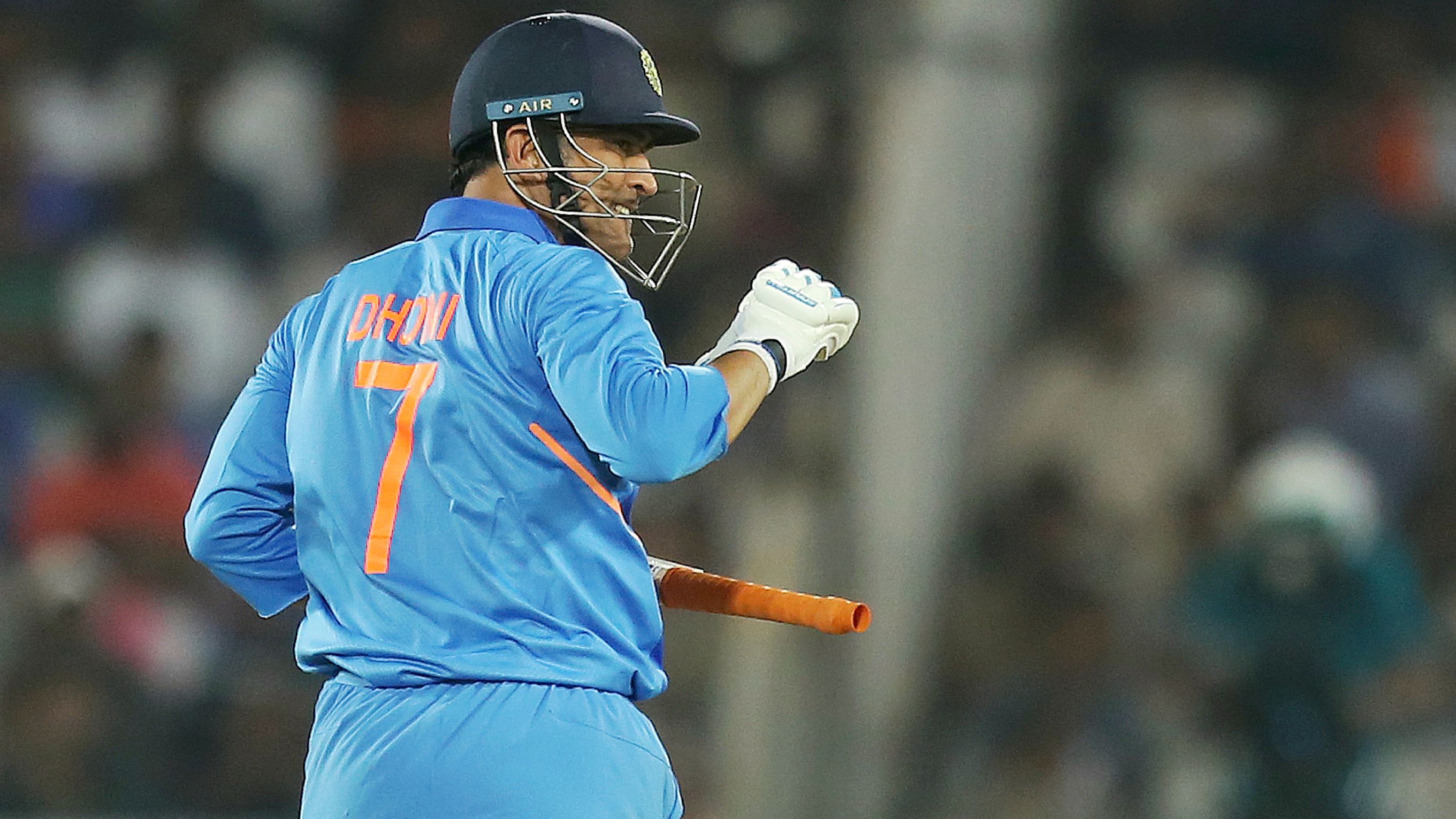 MS Dhoni, seen here batting during the first ODI between India and Australia, was quick to assume driver duties as Team India arrived in his hometown, Ranchi.