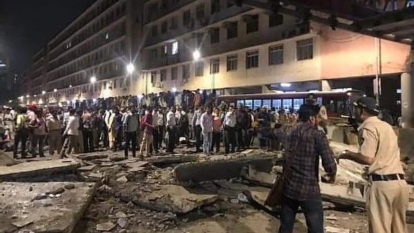 An eyewitness said that at least 100 people were there on the overbridge when it collapsed.