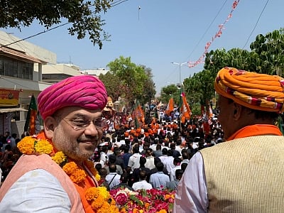 Gandhinagar: BJP chief Amit Shah during a roadshow ahead of 2019 Lok Sabha elections in Gandhinagar, Gujarat on March 30, 2019. (Photo: IANS)