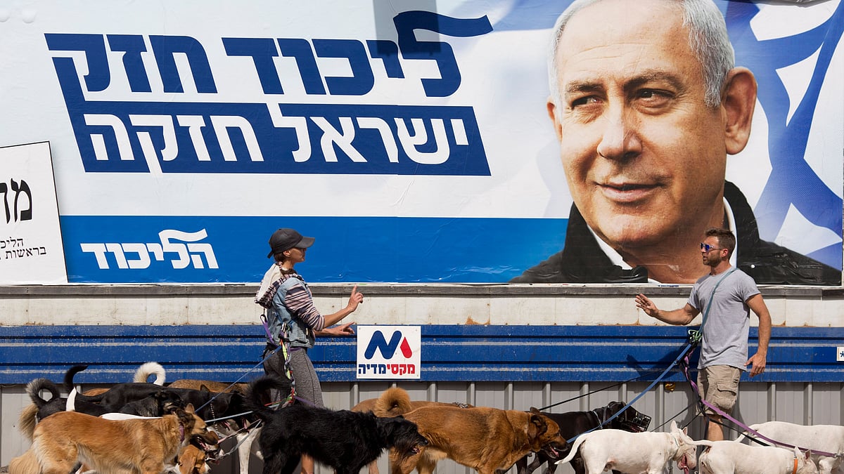 Israel’s election boils down to a referendum on Prime Minister Benjamin Netanyahu, who has dominated the country’s politics for the better part of three decades. The Hebrew writing say “Strong Likud, Strong Israel.”