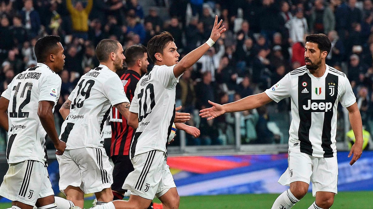 Juventus’ Paulo Dybala celebrates after scoring his team’s first goal during the Italian Serie A soccer match between Juventus and AC Milan.