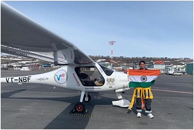 Mumbai: Captain Aarohi Pandit poses with the Indian flag after landing in Canada on May 14, 2019. Captain Aarohi Pandit, a 23-year-old pilot from Mumbai became the world