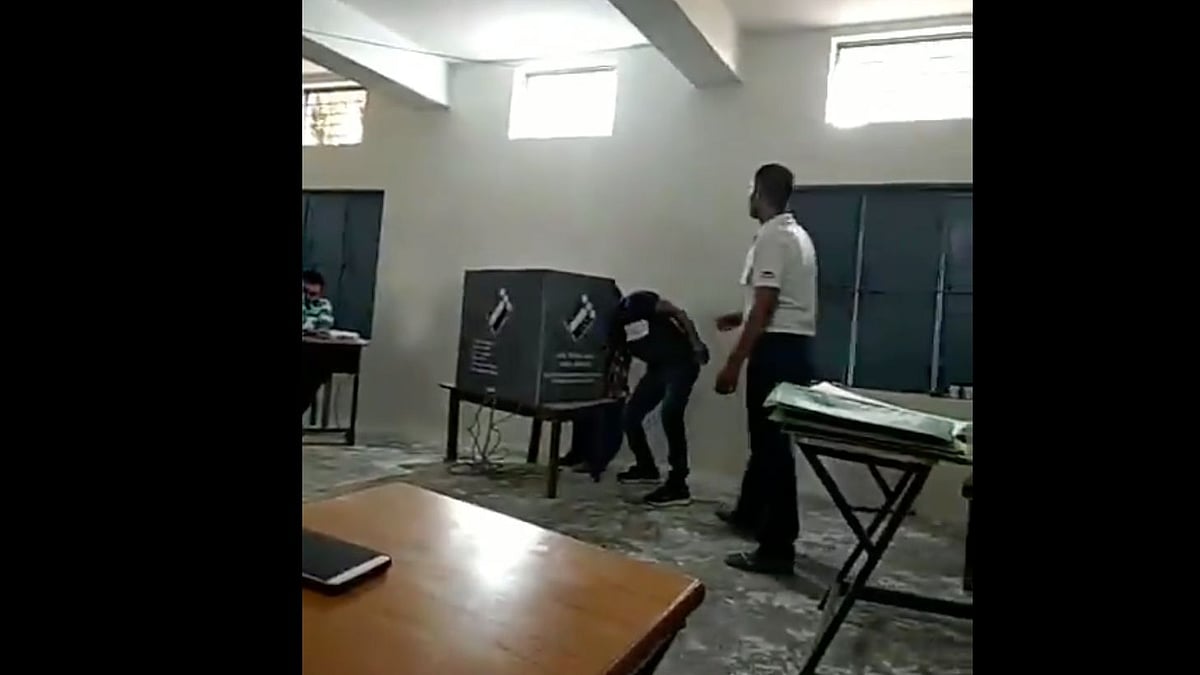 The man seems to be interfering with the voting process every time someone comes to vote.