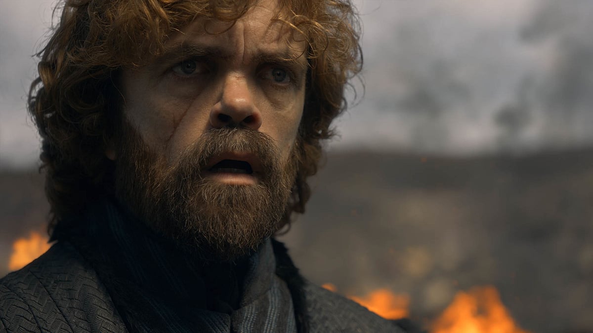 Tyrion Lannister looks ahead in shock as Dany burns the city down.