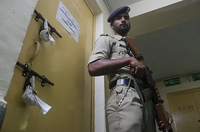 New Delhi: A security personnel stands guard outside an EVM strongroom ahead of the sixth phase of 2019 Lok Sabha elections, in New Delhi on May 11, 2019. (Photo: IANS)
