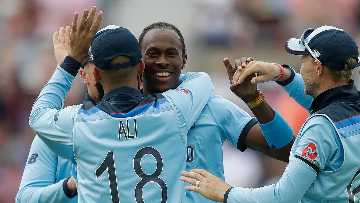England’s Jofra Archer, second left, celebrates taking the wicket of South Africa’s Rassie van der Dussen during the World Cup cricket match between England and South Africa at The Oval in London, Thursday, May 30, 2019. 