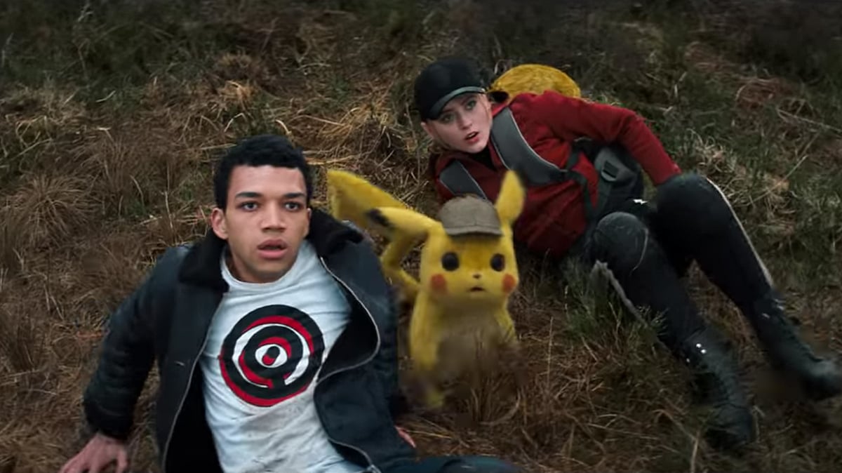Justice Smith and Kathryn Newton and Pikachu in a still from P<i>okémon Detective Pikachu.</i>