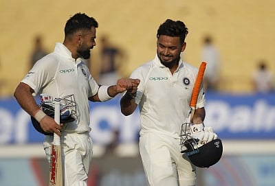 Rajkot: Indian captain Virat Kohli and Rishabh Pant return back to the pavilion after the end of first day