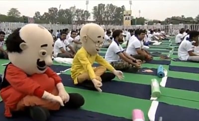 Ranchi: Iconic cartoon characters Motu and Patlu also performed yoga with Prime Minister Narendra at Prabhat Tara Maidan in Ranchi on June 21, 2019. (Photo: IANS/PIB)