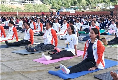 Tawang: People practice yoga asanas - postures - on the 5th International Yoga Day at Gyalwa Tsangyang Gyatso High Altitude Stadium in Tawang, Arunachal Pradesh on June 21, 2019. (Photo: IANS)