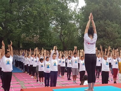 Beijing: People practice yoga asanas -postures- on International Yoga Day 2019 in Beijing, China on June 21, 2019. (Photo: IANS/MEA)