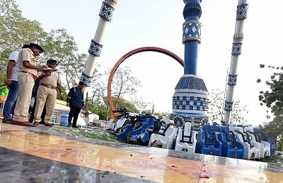 Ahmedabad: Police personnel inspects the site where at least three persons were killed and as many as 31 others injured when an amusement ride collapsed at the public park around the sprawling Kankaria Lake, in Ahmedabad on July 14, 2019. (Photo: IANS)