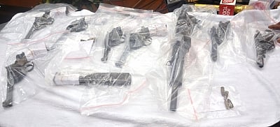 Kolkata: The arms that were being sold illegally on display during a press conference in Kolkata on May 7, 2018. A Special Task Force (STF) of Kolkata Police on Monday nabbed six people for selling the arms after acquiring them from Icchapur Rifle Factory in West Bengal. (Photo: IANS)